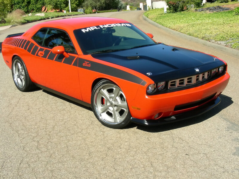 Orange Dodge Challenger with black hood