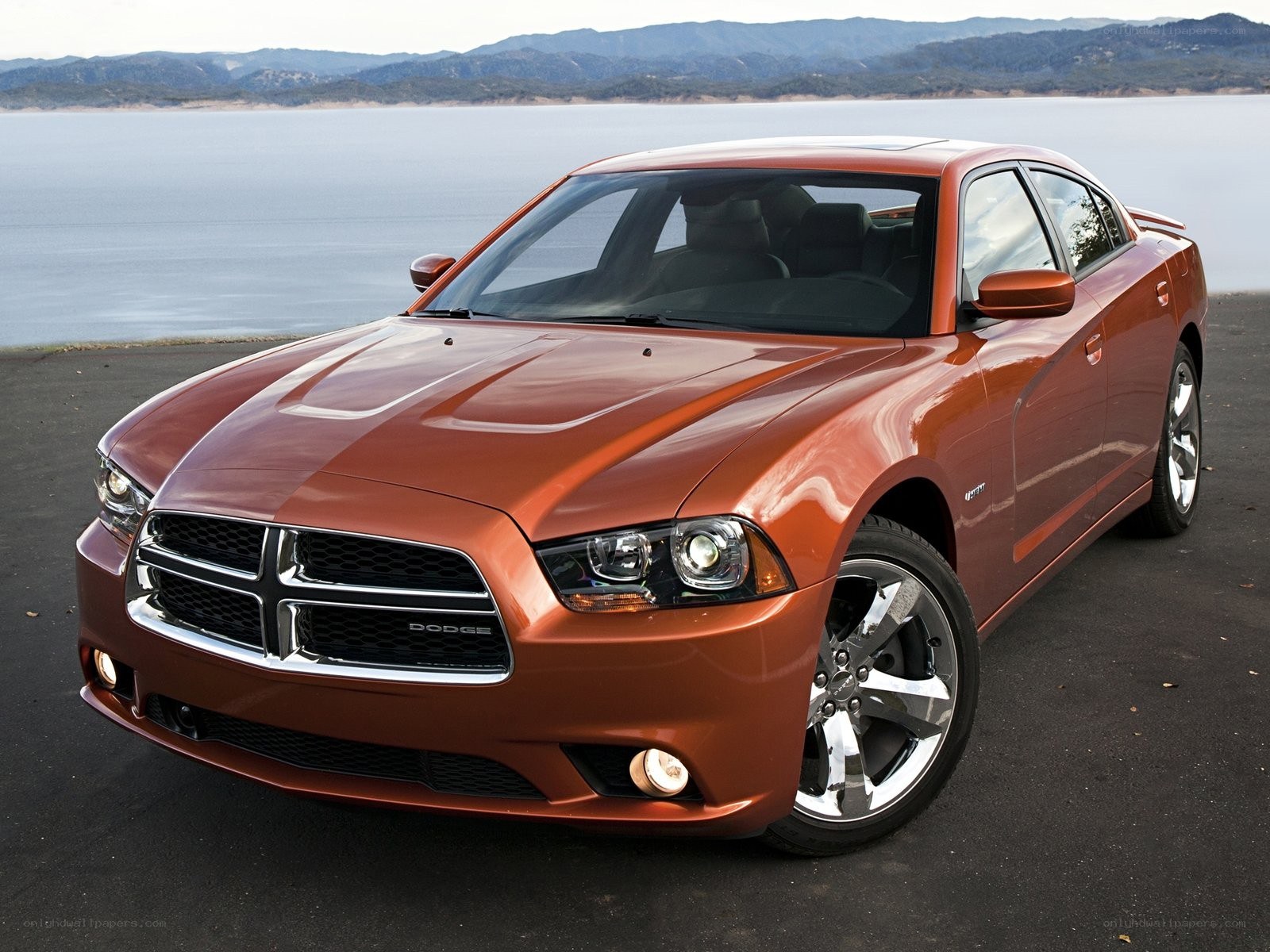 Orange Dodge Charger by the lake