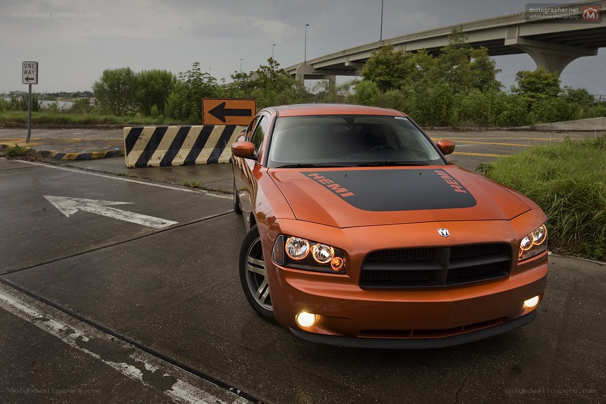 Orange Dodge Charger on road