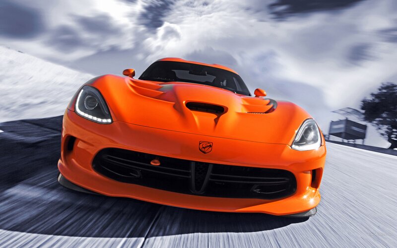 Orange Dodge Viper in motion