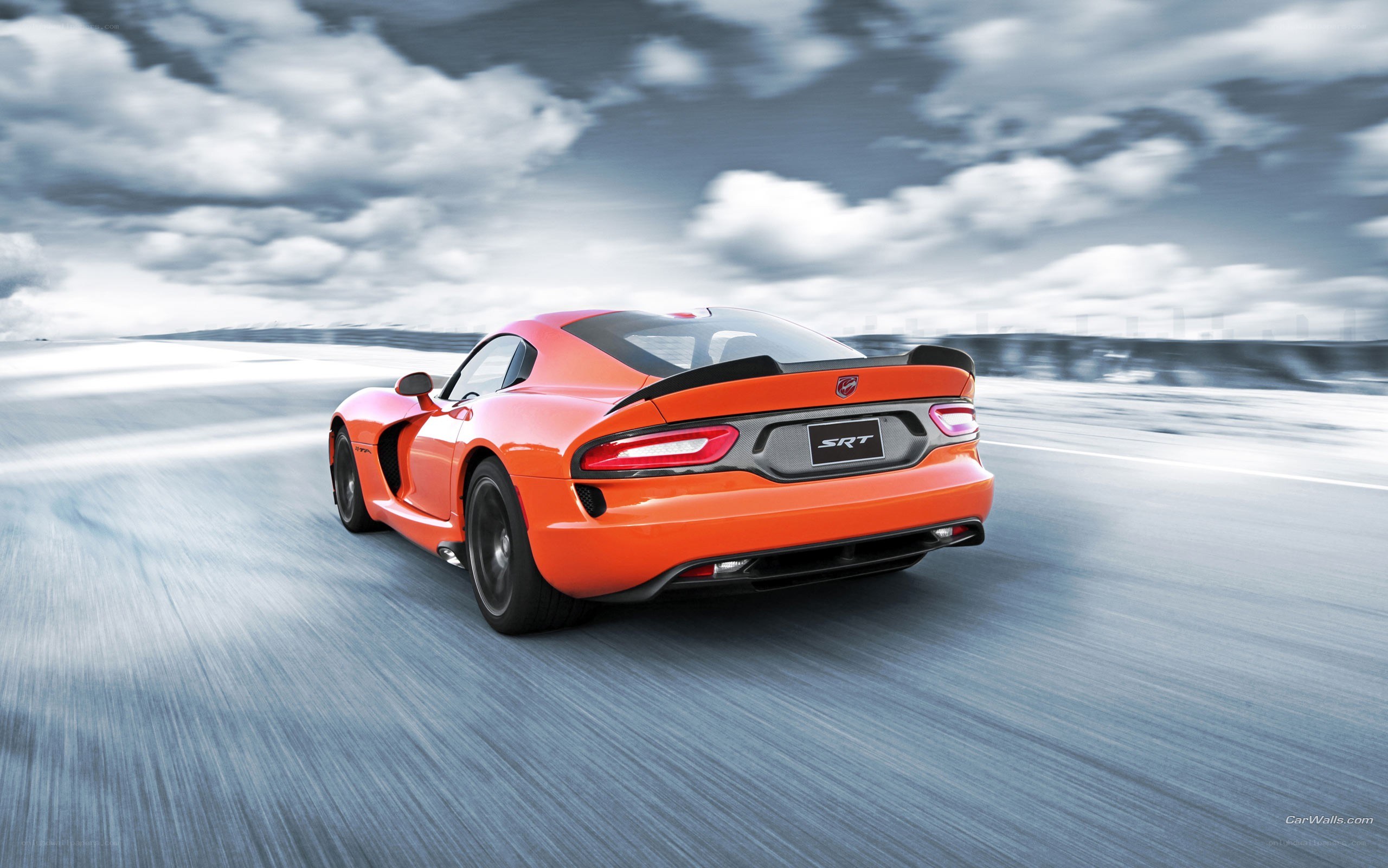 orange Dodge Viper SRT in motion