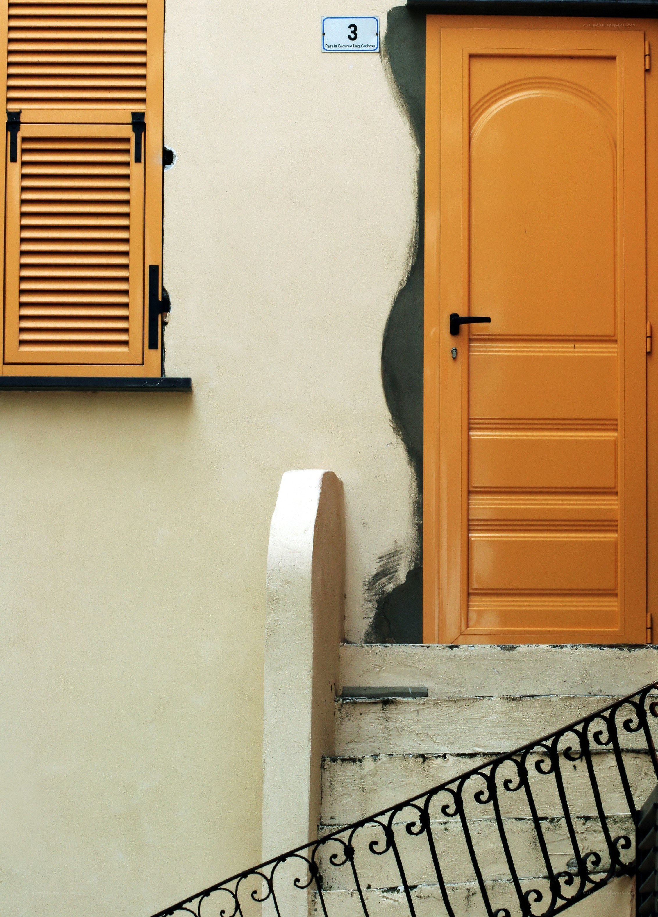 Orange door and shutters