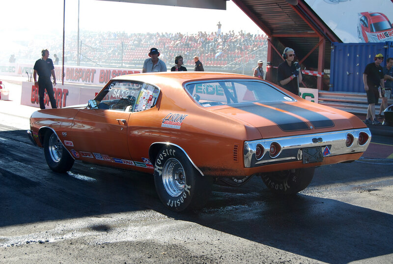 Orange drag racing car at the track