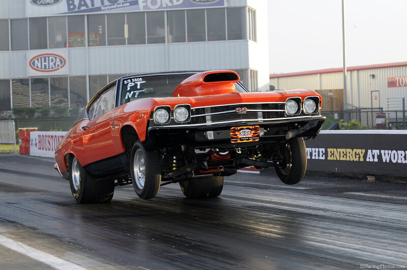 Orange drag racing car on track