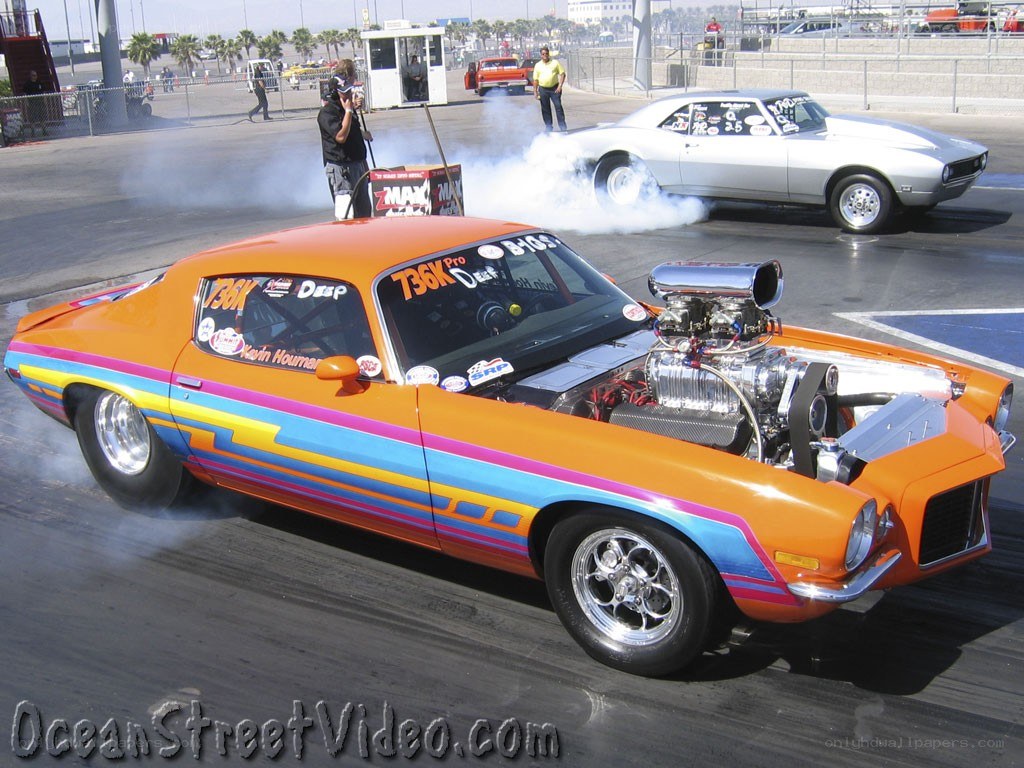 Orange drag racing car on track