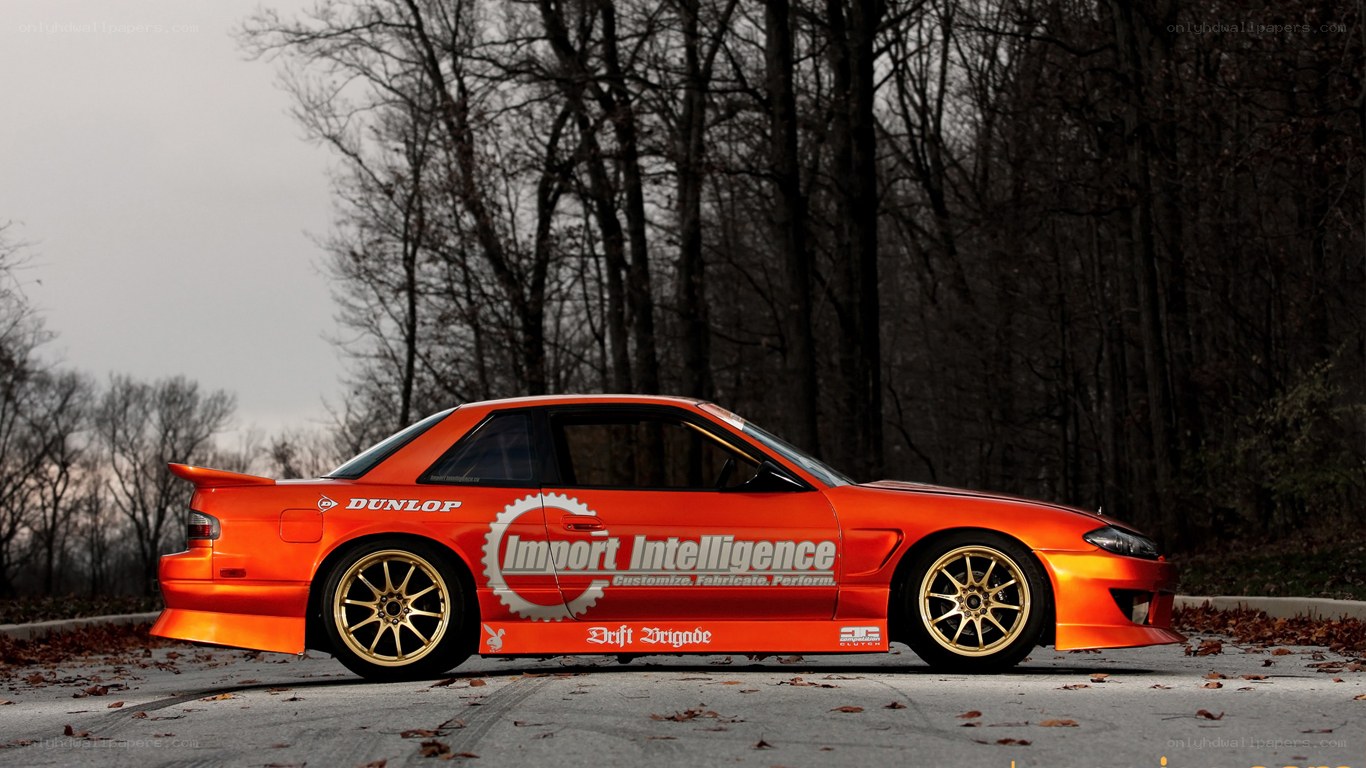 orange drift car in forest