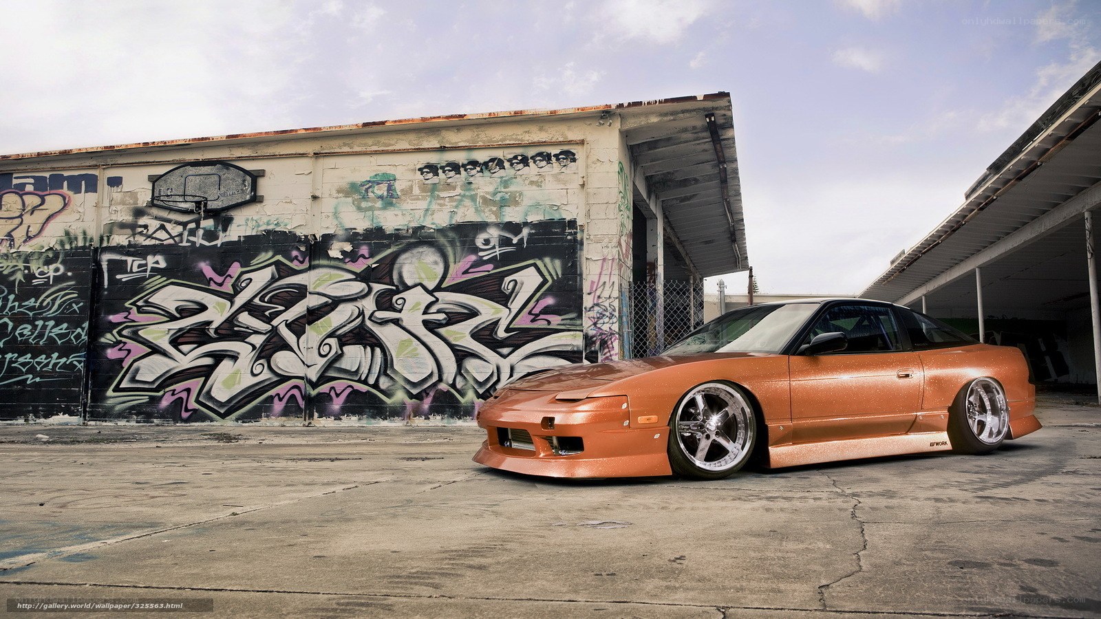 Orange drift car in graffiti alley