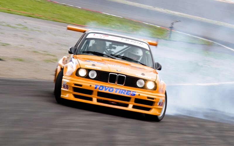 Orange drift car on track