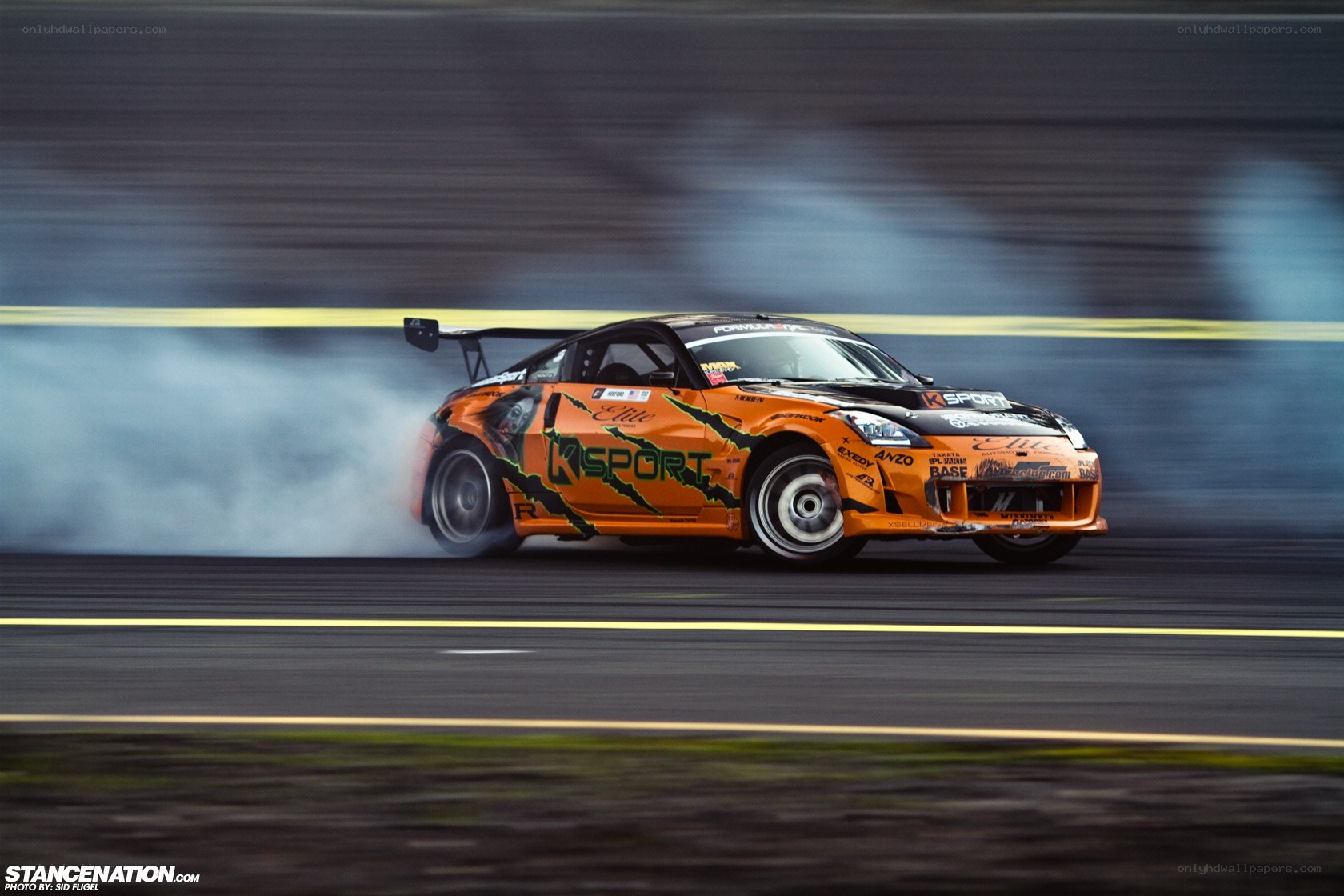 Orange drift car on track
