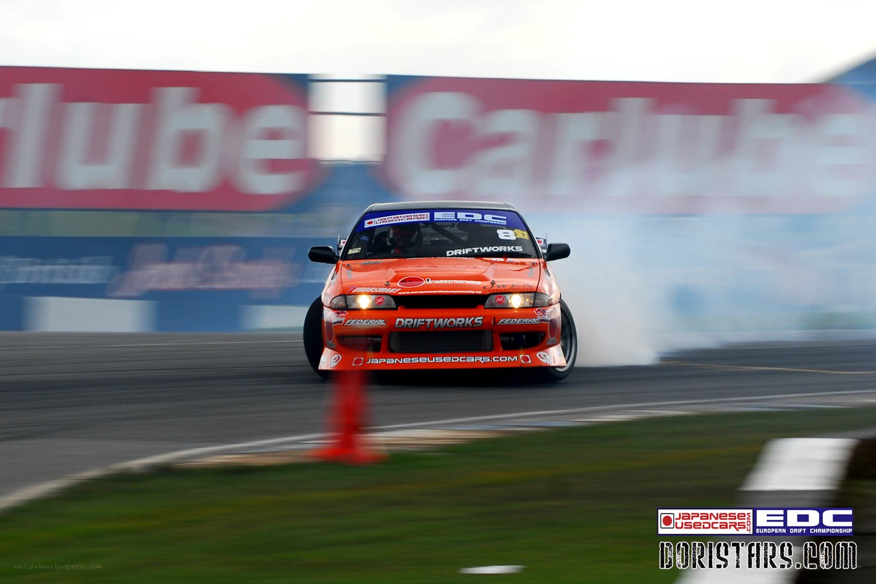 orange drift car on track