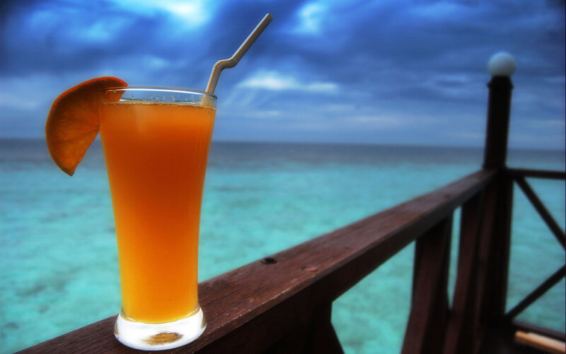 Orange Drink on Railing — Blue