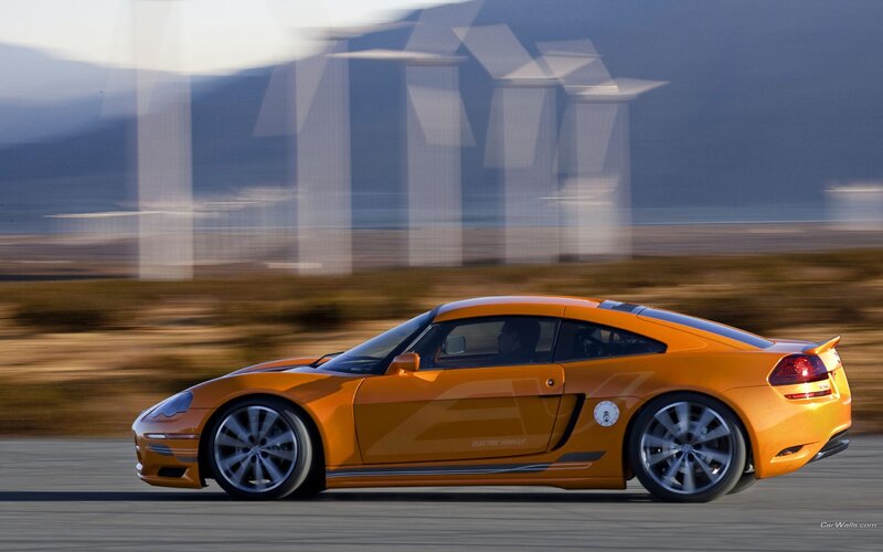 orange electric sports car in motion