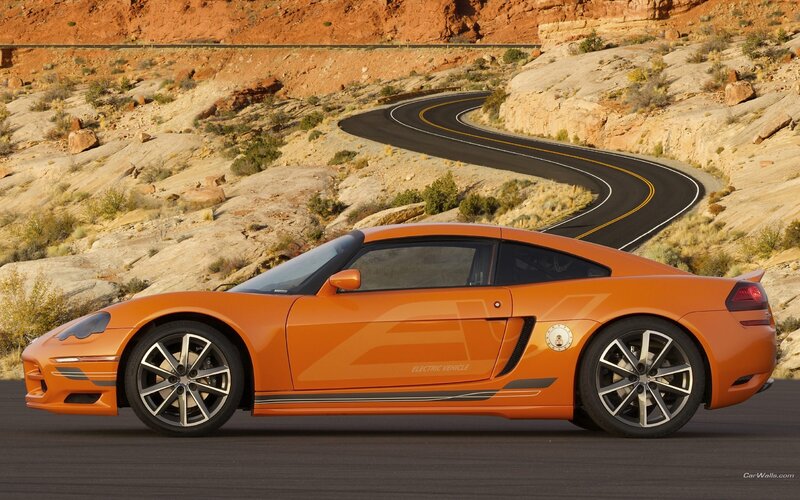 orange electric sports car on desert road