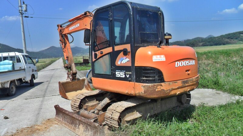 Orange Excavator on Road