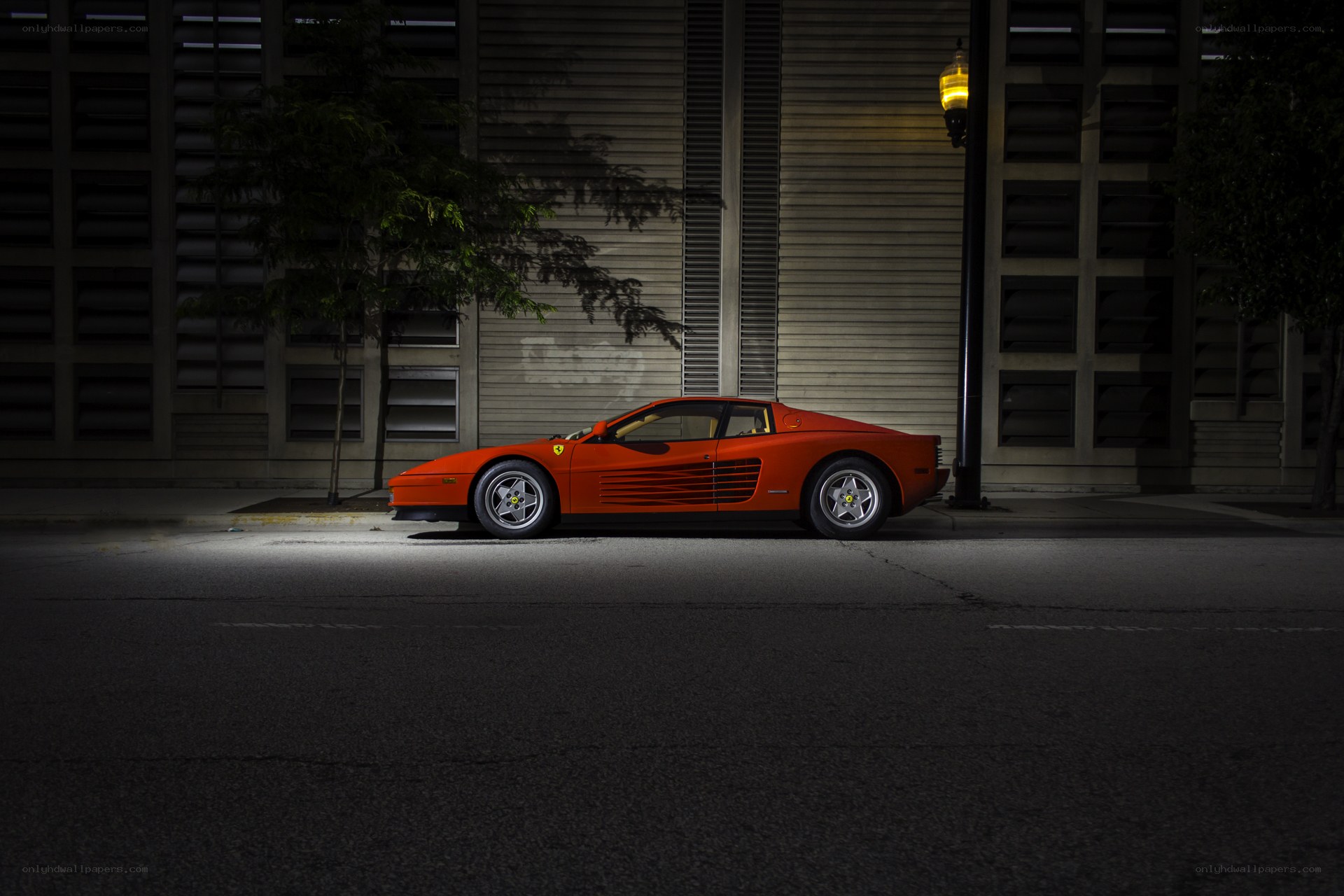 Orange Ferrari at night
