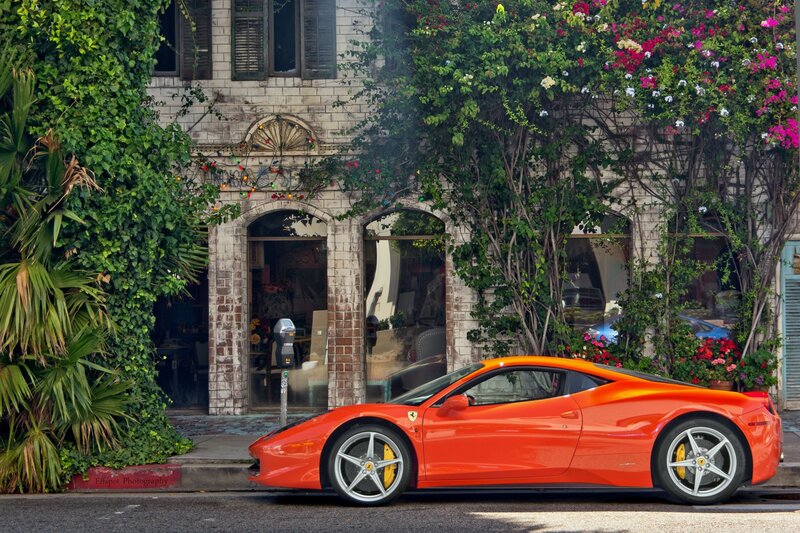 Orange Ferrari parked on a street