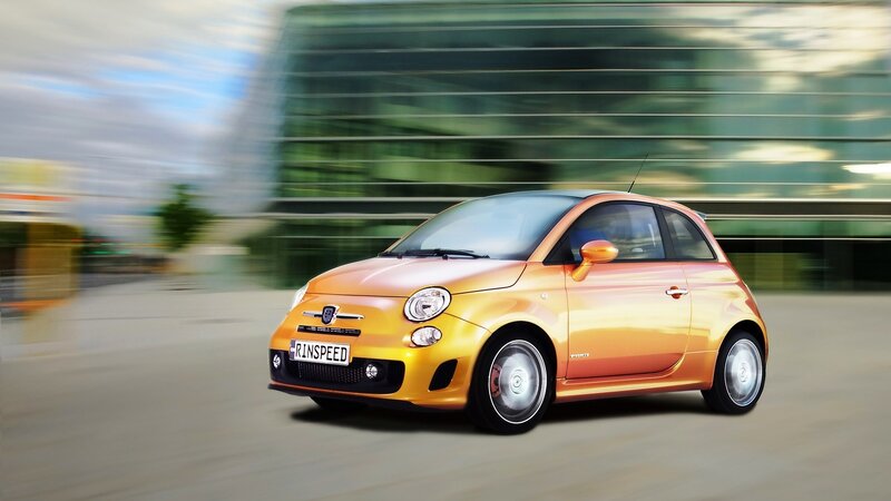 Orange Fiat 500 in motion