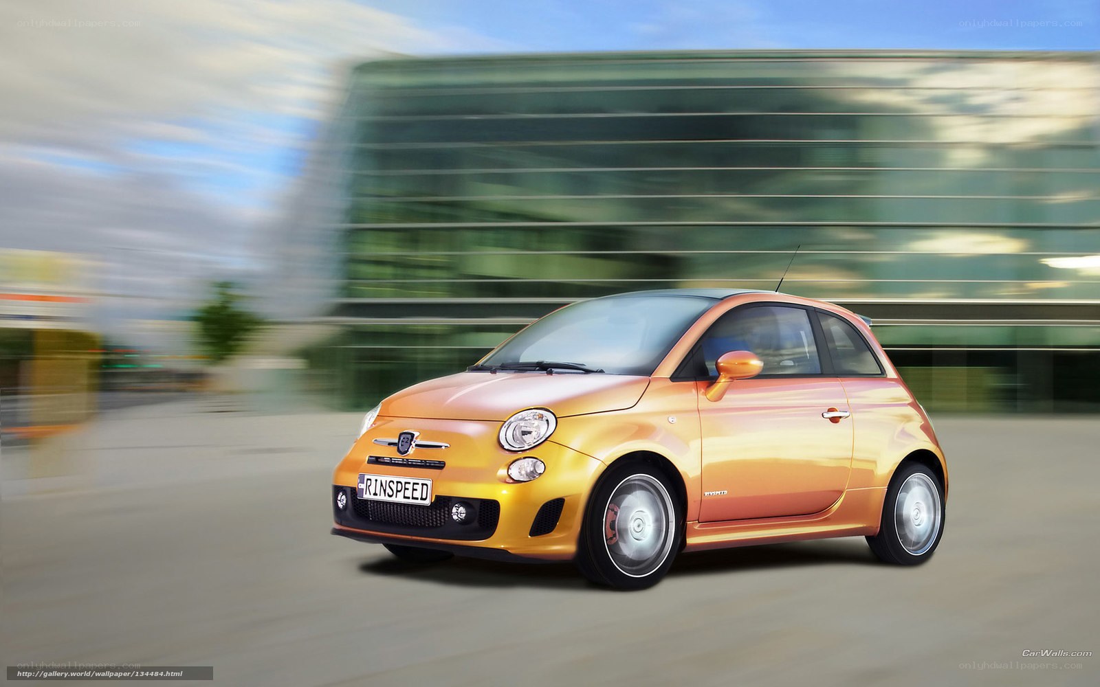 Orange Fiat 500 in motion