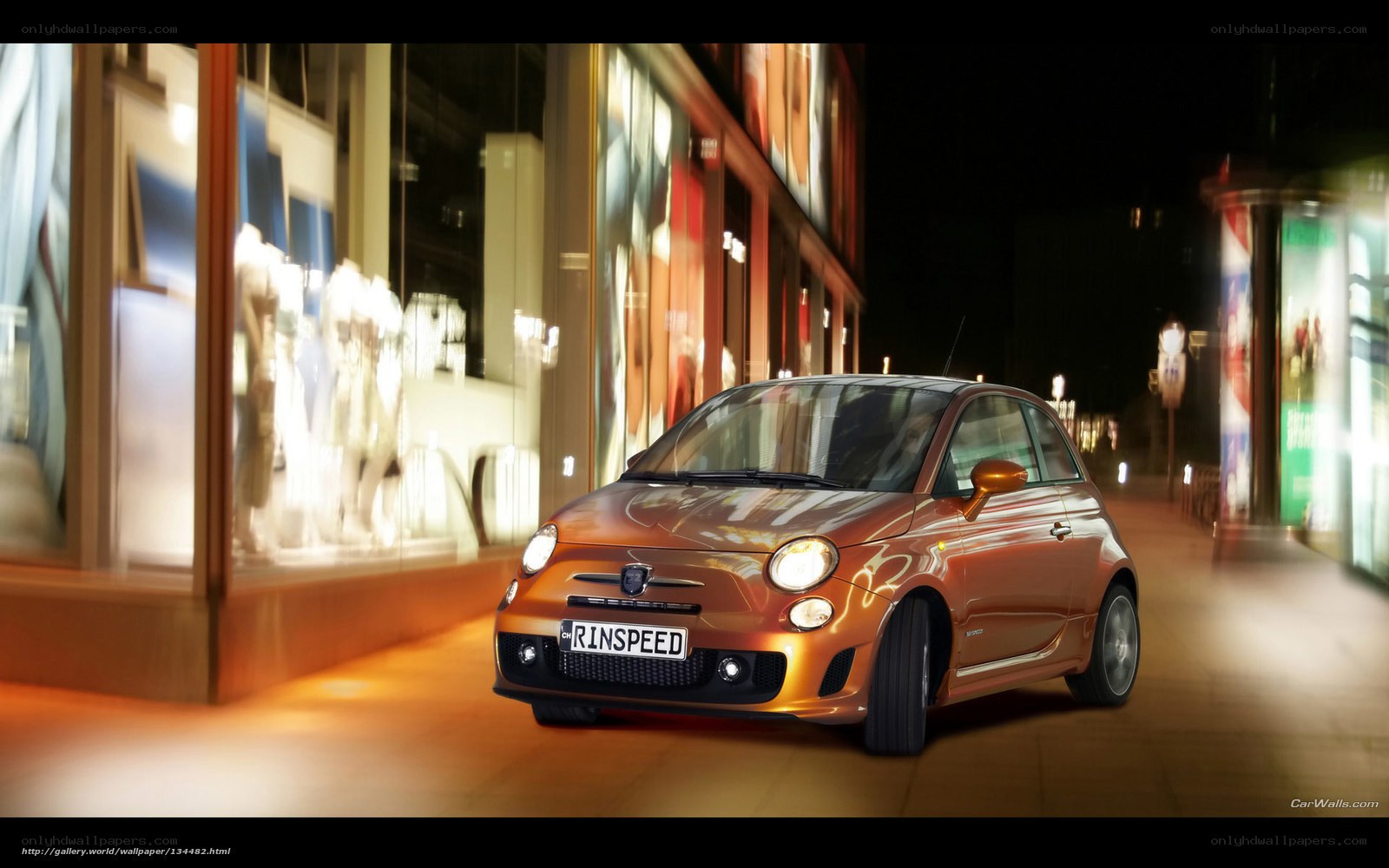 Orange Fiat 500 on city street