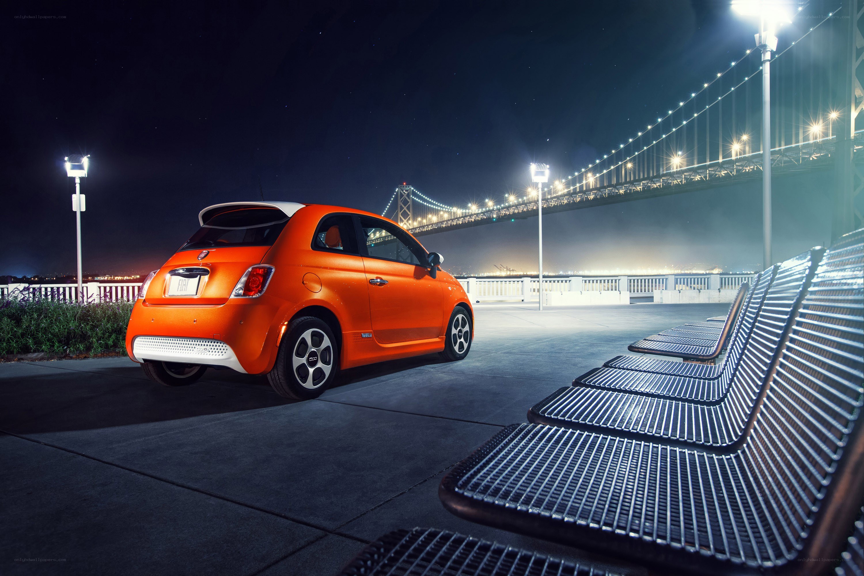 Orange Fiat 500e at night