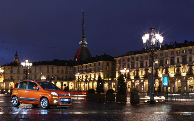 Orange Fiat Panda at night in Turin