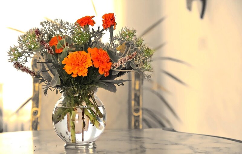 Orange flowers in a glass vase