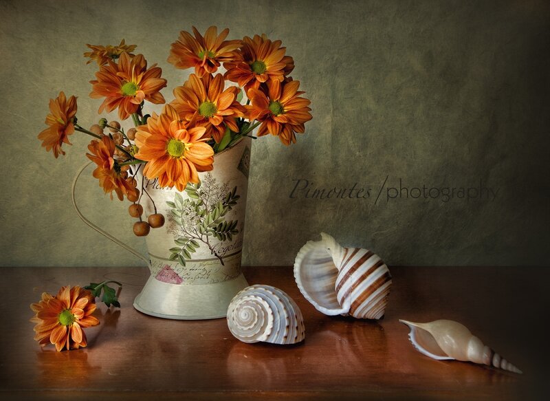 Orange Flowers in Pitcher