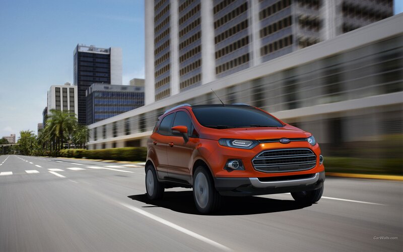 Orange Ford EcoSport driving in city