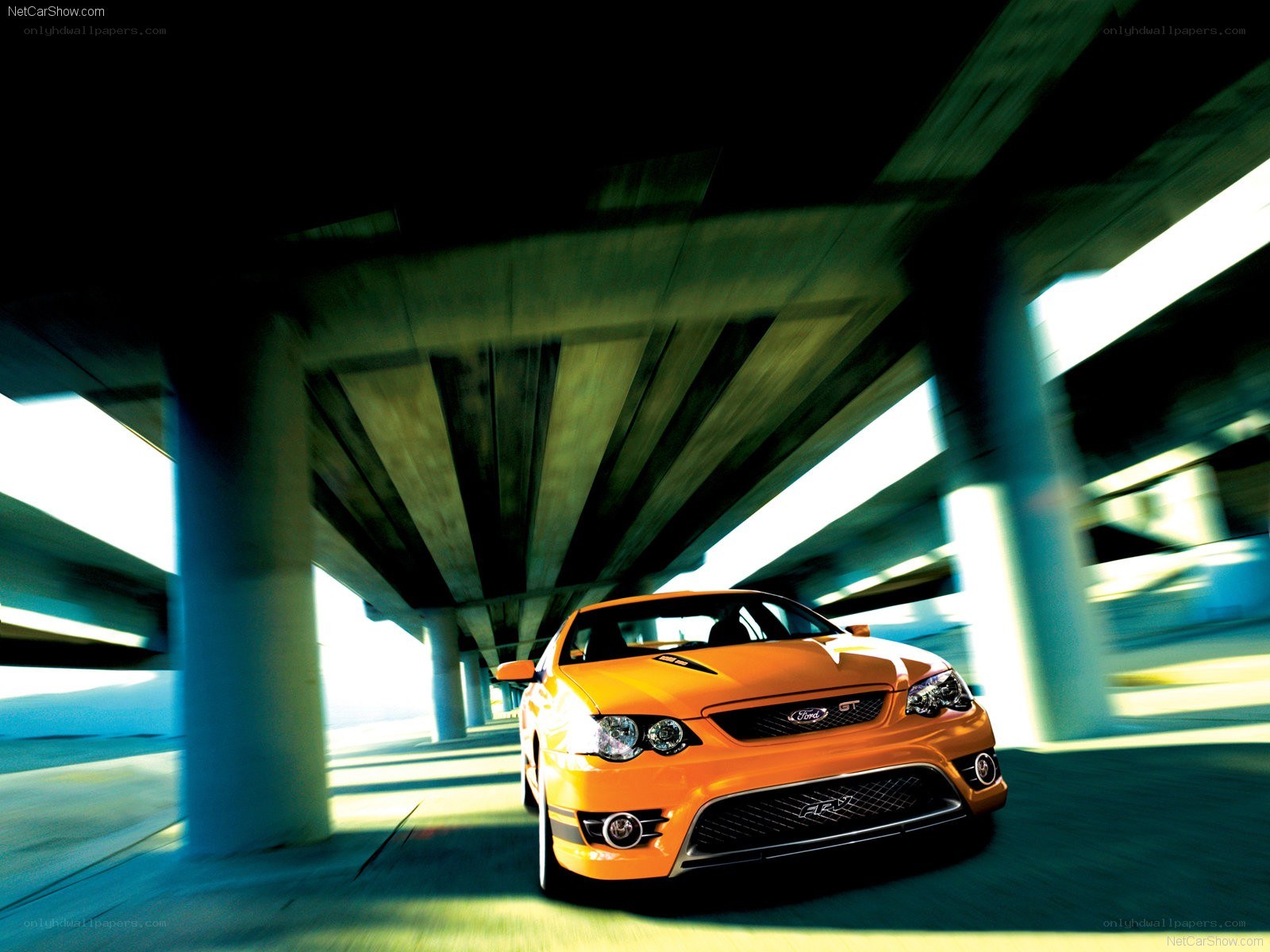 Orange Ford Falcon GT in motion