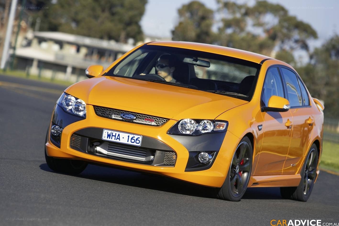orange ford falcon in motion