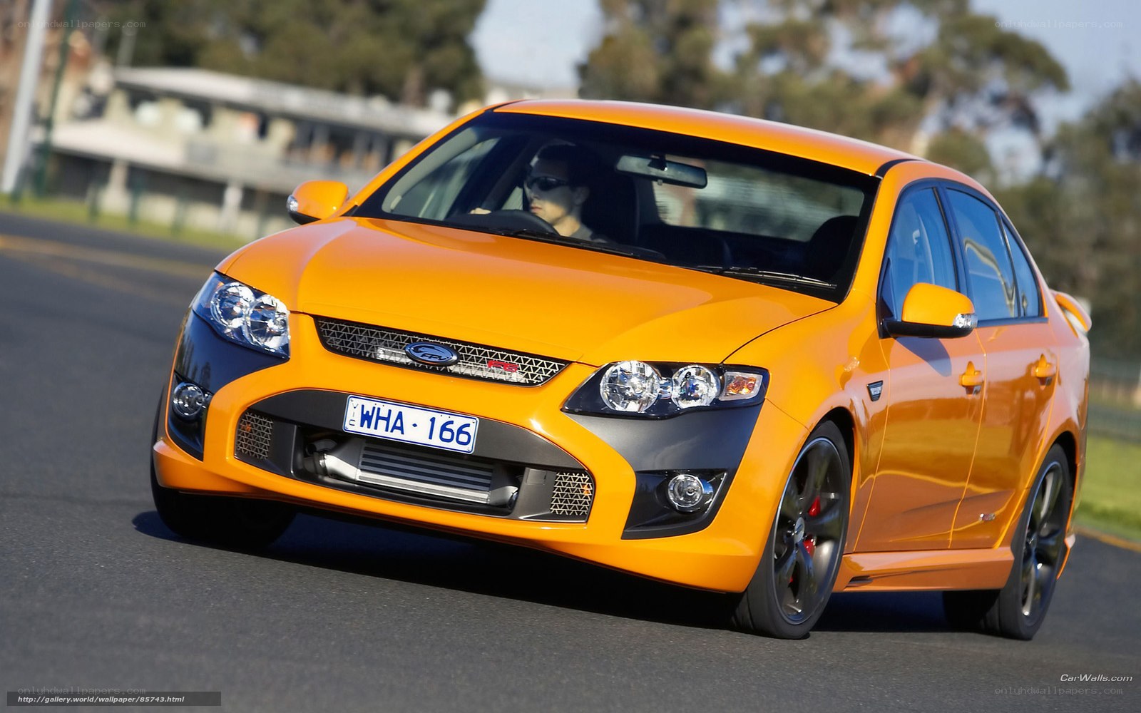 orange ford falcon in motion