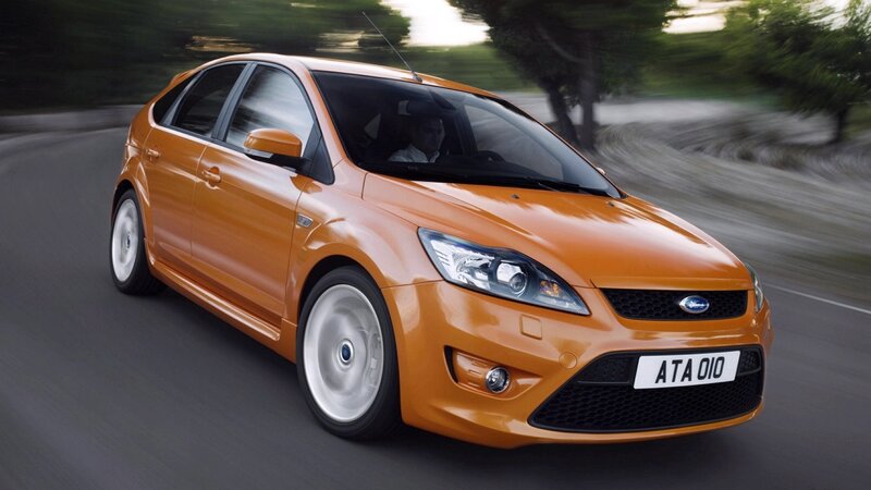 orange ford focus in motion