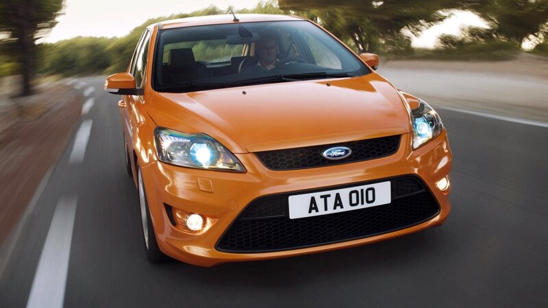 orange ford focus in motion