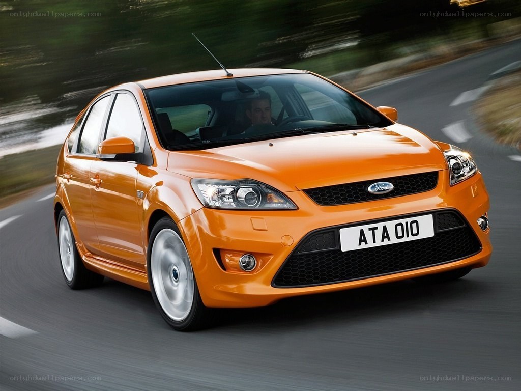 Orange Ford Focus in motion