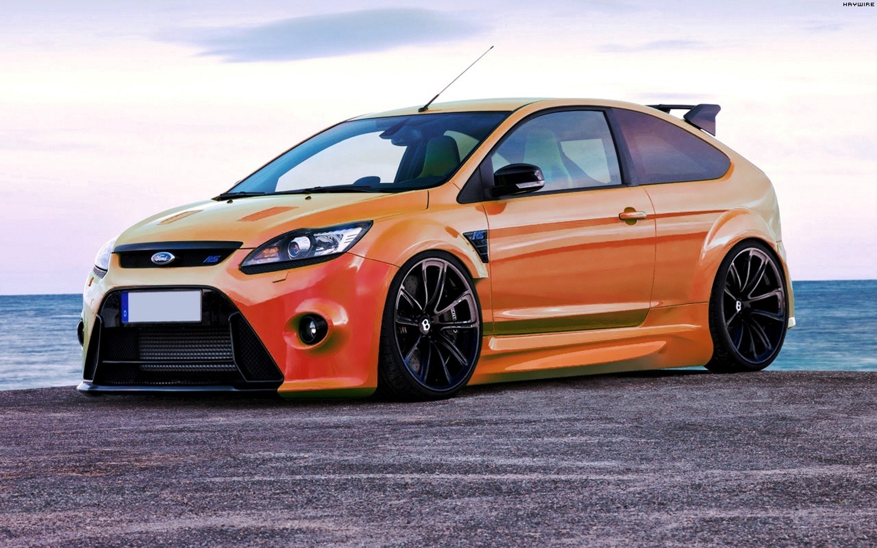 Orange Ford Focus RS on beach