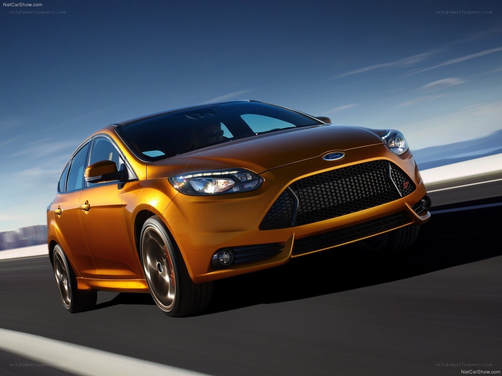 Orange Ford Focus ST in motion