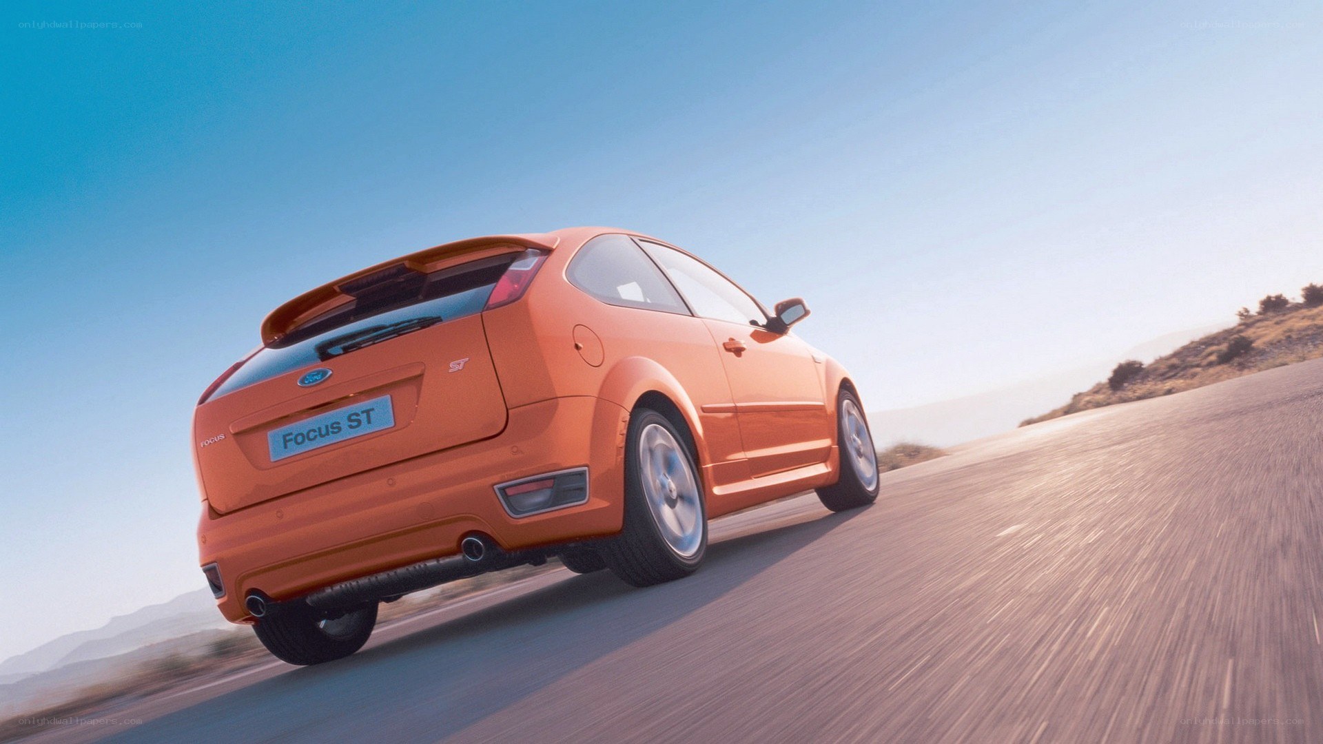 Orange Ford Focus ST on road