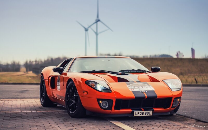 Orange Ford GT with wind turbines