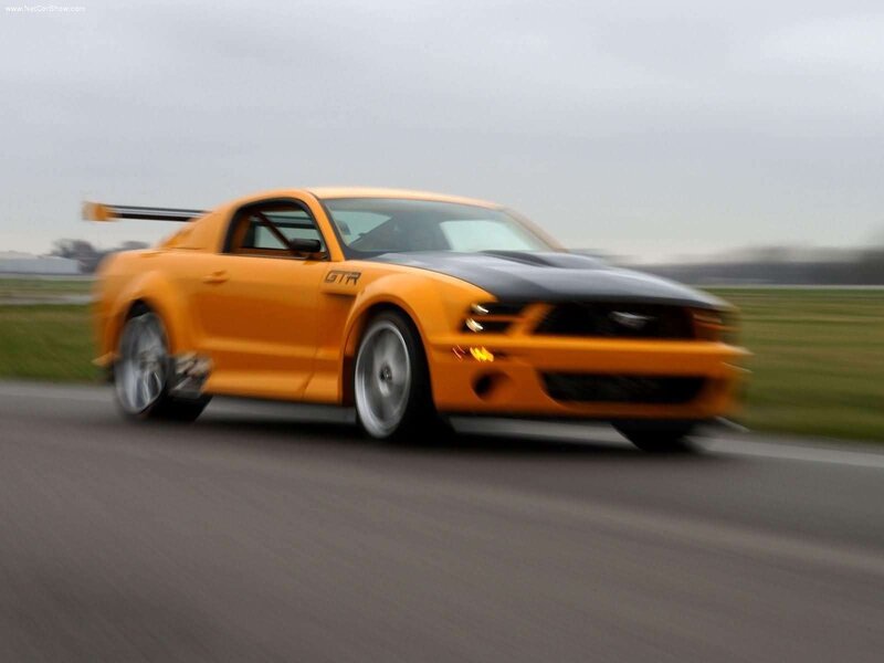 orange ford mustang gtr on track