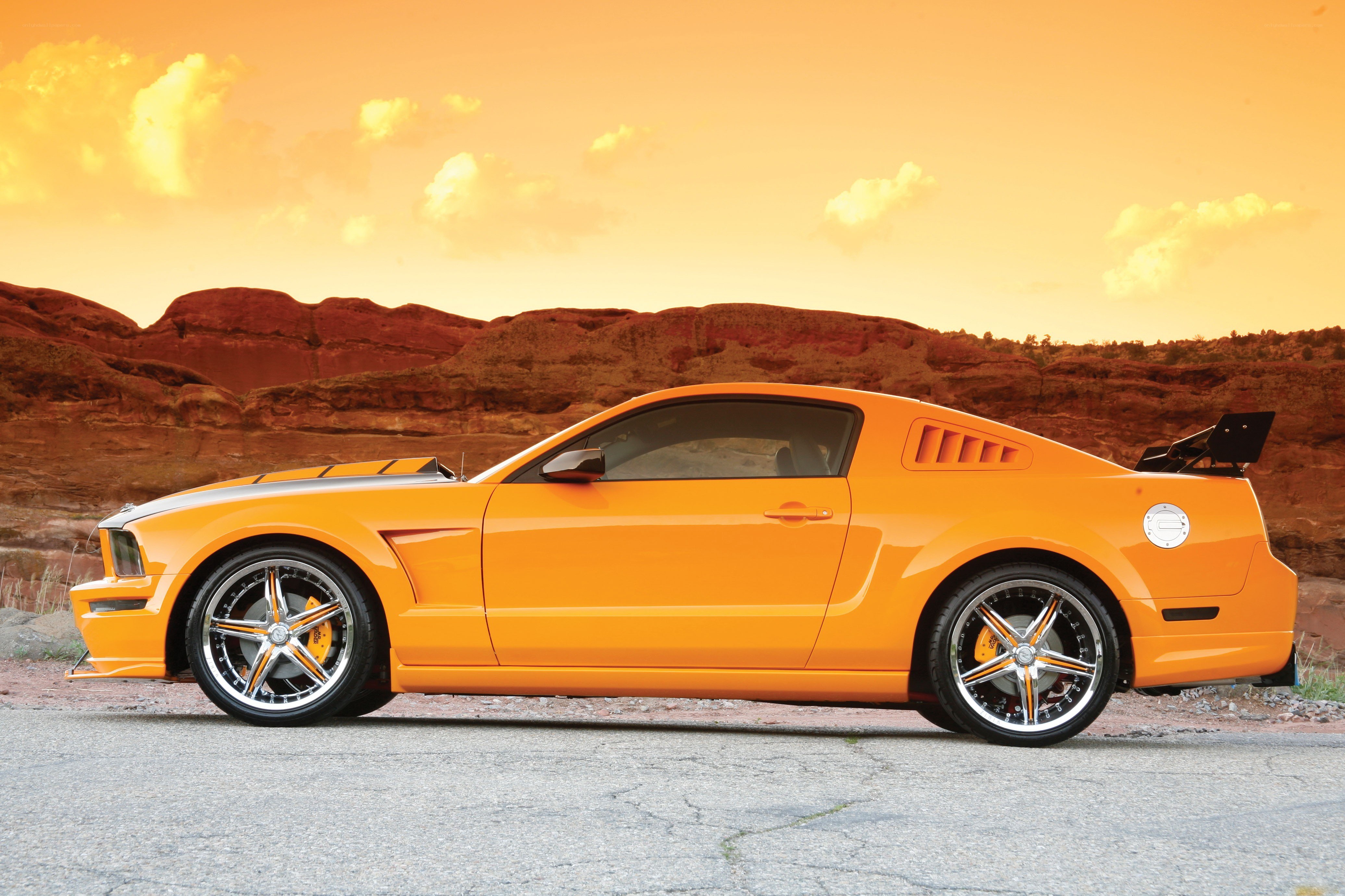 Orange Ford Mustang in desert
