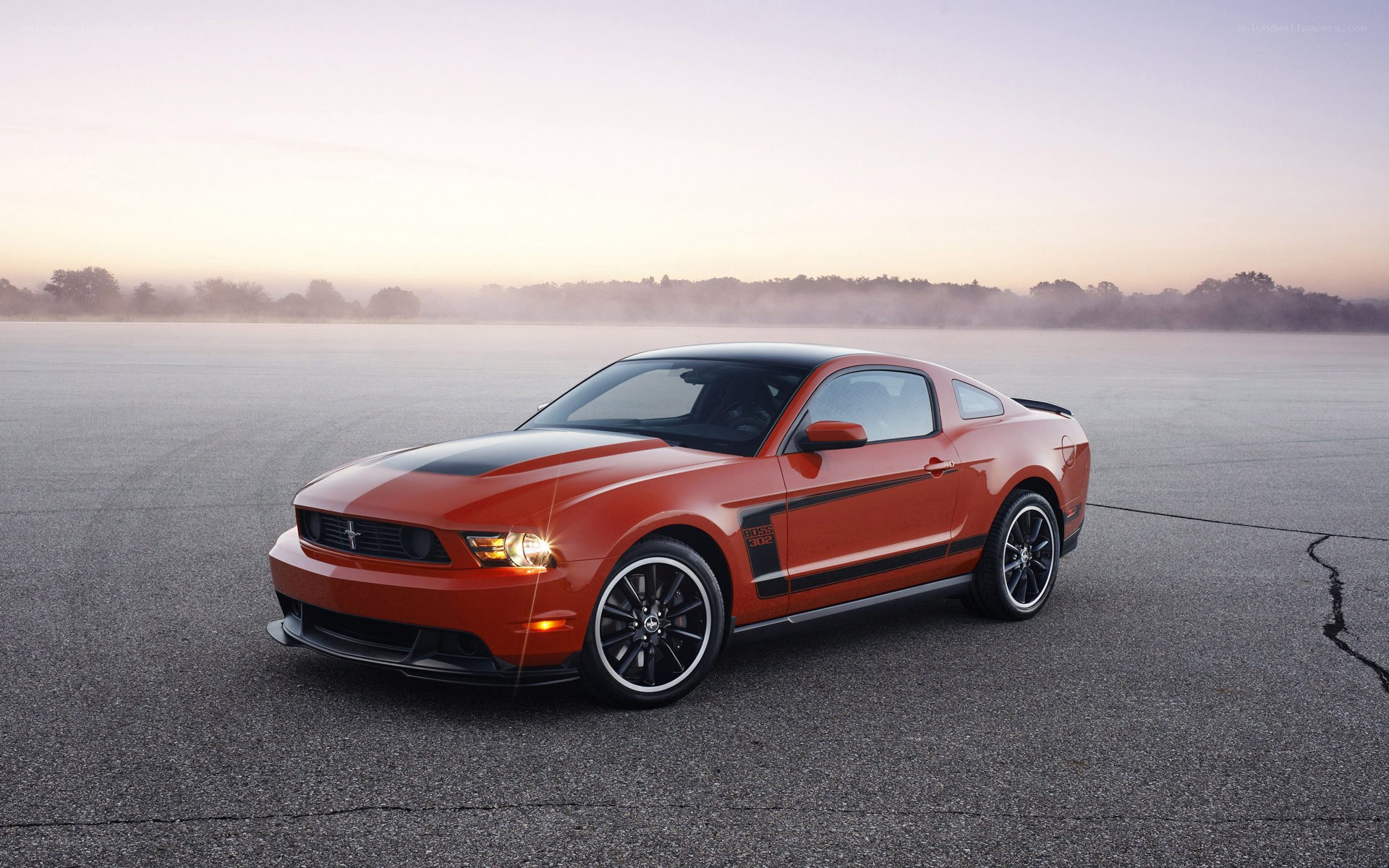 Orange Ford Mustang on a track