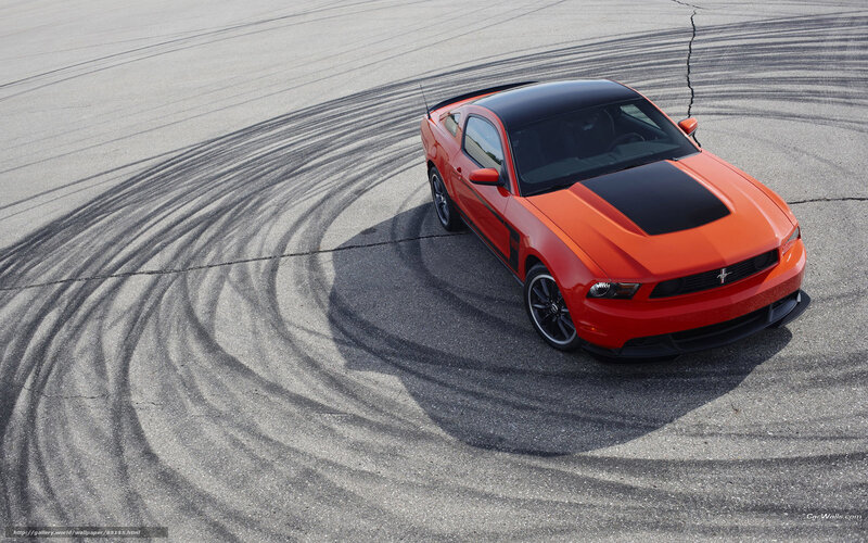 Orange Ford Mustang on track