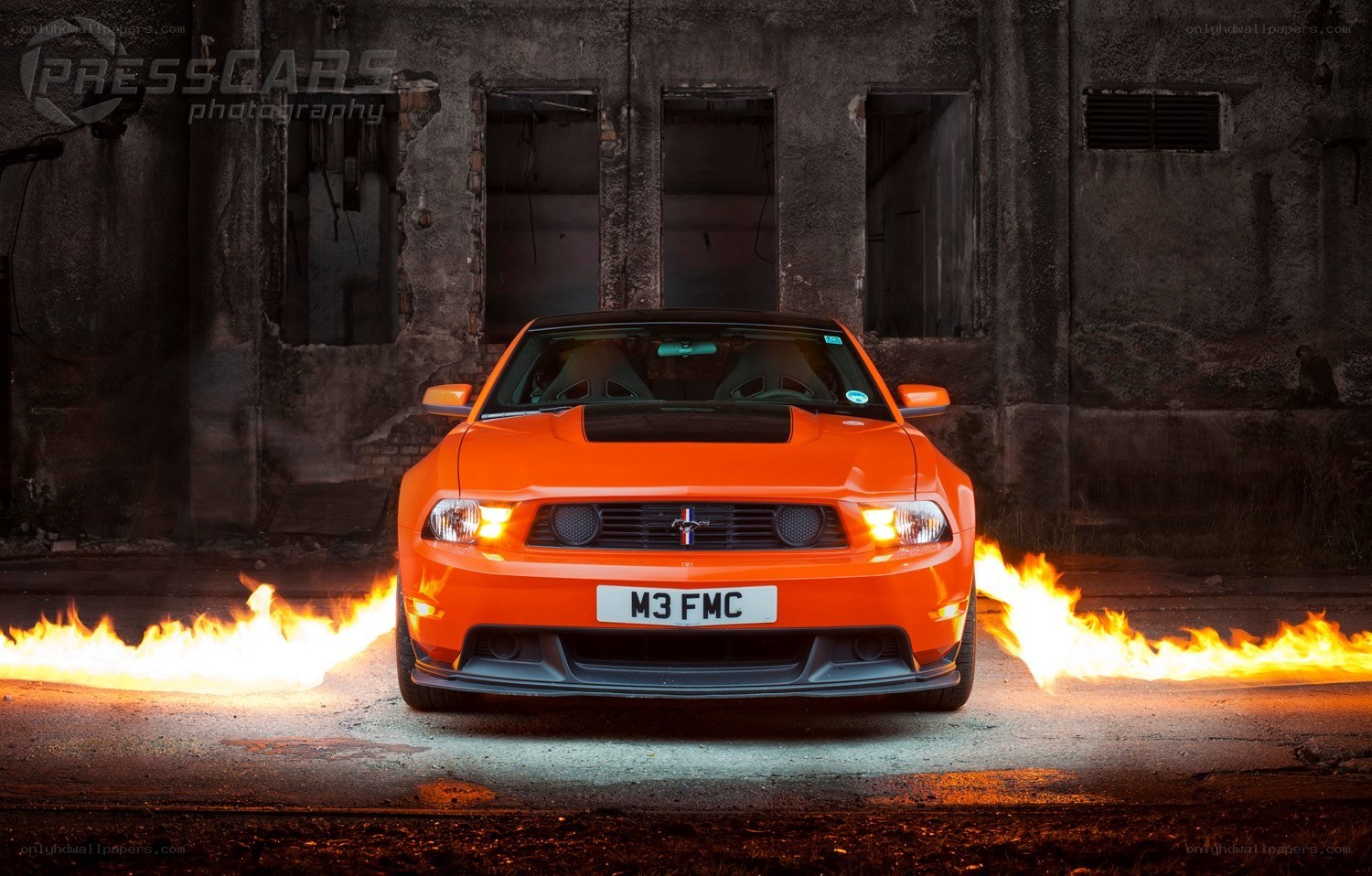 Orange Ford Mustang with flames