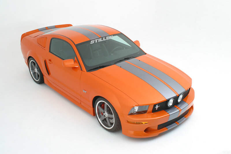 Orange Ford Mustang with racing stripes