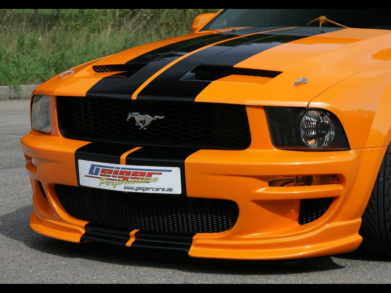 Orange Ford Mustang with racing stripes
