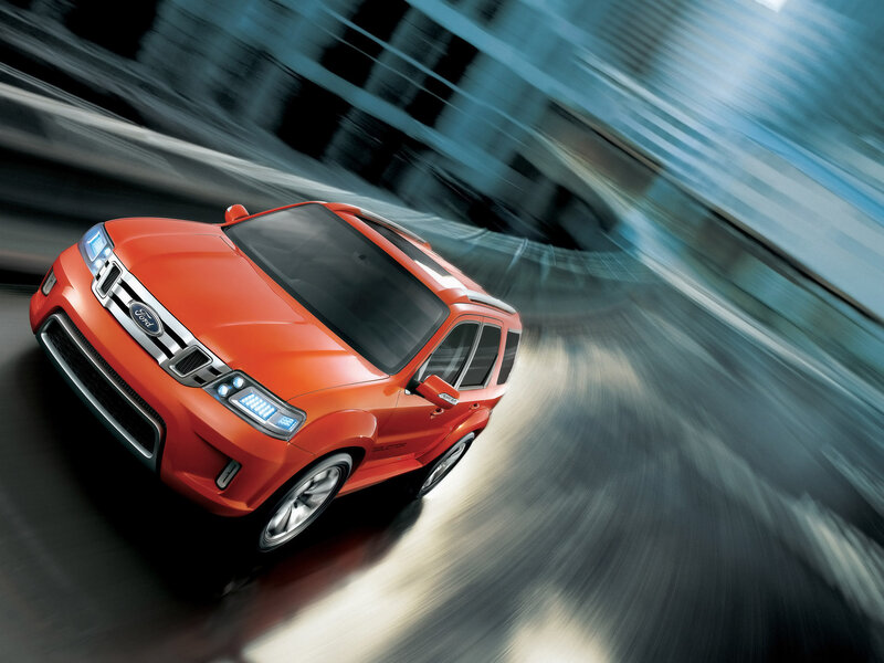 Orange Ford SUV in motion