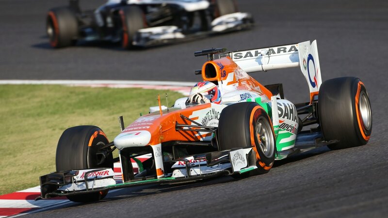 Orange Formula One Car — Dynamic, Afternoon, Photograph, Racing Car