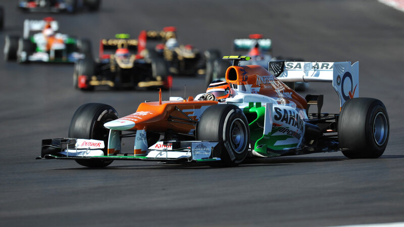 Orange Formula One Car — Dynamic, Afternoon, Photograph, Racing Driver
