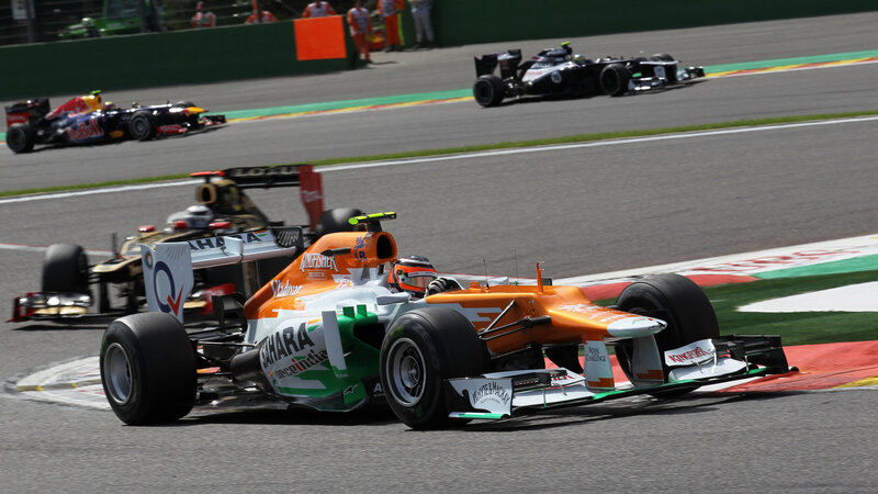 Orange Formula One Car — Dynamic, Afternoon, Photograph