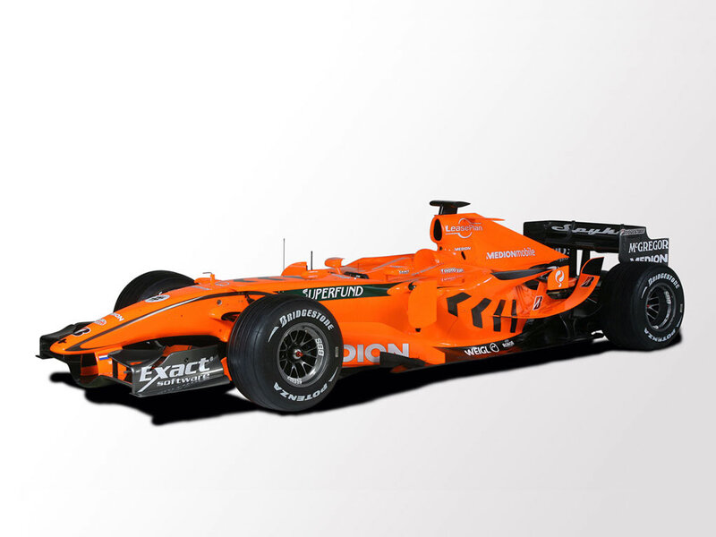 Orange Formula One Car — Neutral, Photograph, Tires
